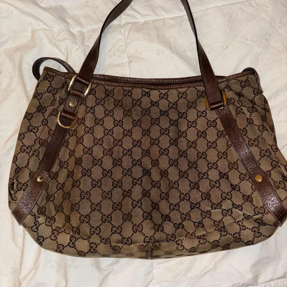 Used Vintage Gucci purse. Brown and tan web design.